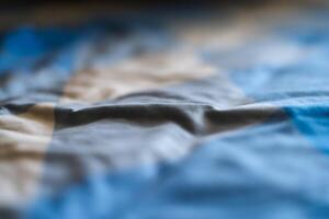Folding fabric action indoor setting textile content close-up view creative process photo