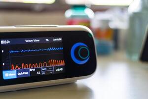 Monitoring health metrics medical device displaying data clinical environment photo