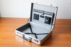 Business briefcase open wooden table workspace setup product minimalist top-down view photo