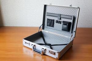 Business briefcase open empty office desk minimalistic space focused perspective photo