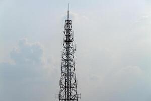 Telecommunication tower urban area overcast sky elevated view connectivity concept photo