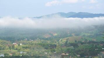A view of a valley with a mountain in the background video