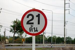 Navigation in rural areas 21 km distance signage at ground level in open environment photo