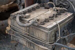 Maintenance of vintage vehicle battery garage technical insight dusty environment close-up view photo