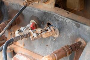 Industrial equipment maintenance workshop close-up mechanic's view hydraulic systems photo