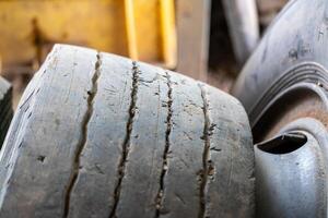 Worn out tires in an industrial setting close-up view of damage workshop environment photo
