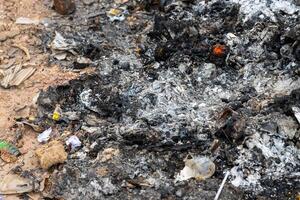 Photographic evidence of urban blaze aftermath debris and ashes in somber atmosphere photo