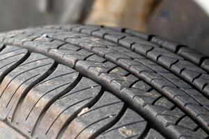 Detailed close-up of tire tread patterns in automotive workshop for safety insights photo