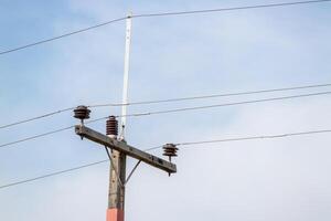 Power lines and utility pole installation urban area clear sky low angle energy infrastructure photo