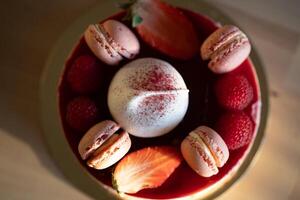 Gourmet Dessert with Raspberry Macarons and Meringue on Golden Plate photo