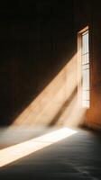 Sunlight streaming through a barred window creates dramatic shadows in an empty room at dusk photo