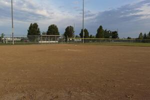 a view from first base to the pitchers mound and third base on a baseball field photo
