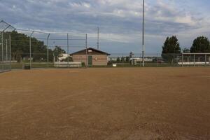 a view from first base to home plate and the third base dugout on a baseball field photo