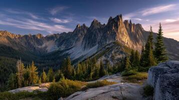 Majestic mountain peaks glow in the warm evening light creating a breathtaking landscape and sense of adventure travel photo