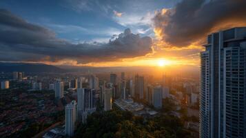 Golden sunrise over Kuala Lumpur modern architecture skyline with dramatic clouds casting shadows over the vibrant cityscape photo