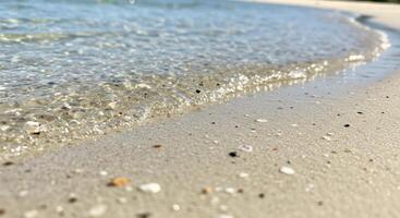 Calm waves meet sandy shore creating tranquil coastal scene with natural textures and beautiful seaside view photo