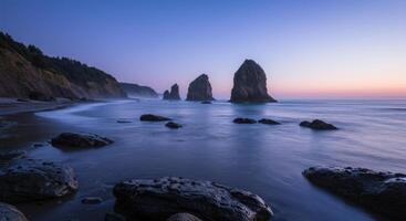 Picturesque Oregon coast featuring dramatic sea stacks under a colorful evening sky creating a serene tranquil and inspiring seascape photo