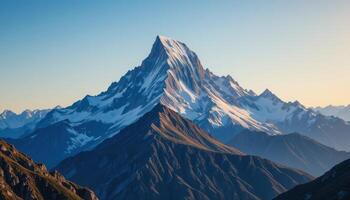 Majestic mountain peaks covered in snow against a vibrant blue sky inspiring adventure and breathtaking panoramic views photo
