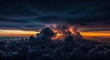 Golden sunset light breaks through dramatic dark clouds creating a majestic landscape view from above photo