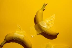 Entangled bananas with avant garde tape, reminiscent of absurdist art, a quirky nod to Unofficial Banana Day celebrations photo