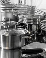 Glistening stainless steel kitchenware arrayed like a culinary orchestra, echoing the spirit of World Food Day and gastronomic innovation photo