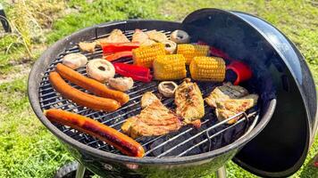 Sizzling barbecue symphony with vibrant peppers, smoky corn, and savory sausages a grill tapestry for Labor Day feasts photo