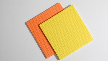 Vibrant, textured kitchen sponges resemble abstract canvases, ideal for National Cleaning Week and quirky home art projects photo