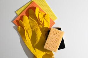 Yellow gloves, textured sponges, vibrant cleaning harmony, spring refresh ritual, Hygge inspired cleanliness, celebrate National Tidy Up Day photo