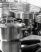 Glistening symphony of chrome pots and whisks, echoing culinary alchemy, St Honore Cake Day gleam, kitchen poetry in motion photo