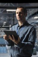 Admin on data center industrial platform analyzing infrastructure performance, minimizing downtime and equipment failure risks. Server farm employee doing job tasks, automating anomaly detection photo
