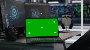 Isolated screen laptop and computer in data center overseeing server infrastructure powering artificial intelligence workflows. Mockup notebook used for monitoring equipment configurations photo