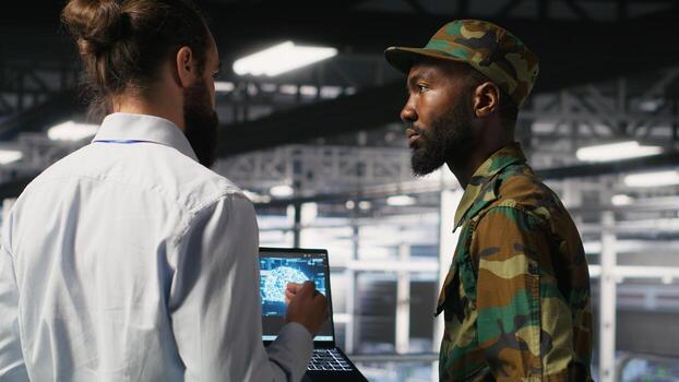 Army technicians in command center server room using artificial intelligence to detect cyber threats. Military data center experts use AI detection software to secure defense systems photo