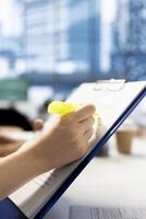 Recruiter using highlighter marker to present contract after finding best talent to fill open company position. Close up of HR employer hired to assess skills of candidate, highlighting text photo