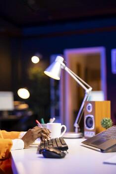Freelancer working from home, typing on laptop keyboard, writing in document. Close up shot of remote worker pressing keys on notebook keyboard, sending emails to coworkers photo