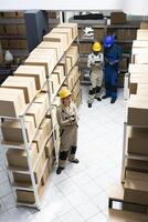 Industrial workspace supporting supply chain process to organize boxes and prepare shipments for dispatch in a highly functional logistics center. Quality control in cargo depot. photo