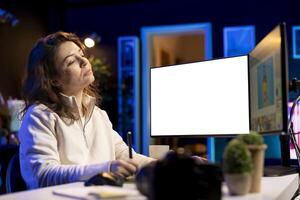 Photographer uses photo editing software on mockup PC display in personal studio. Freelancer uses photographs retouching program on isolated screen multi monitor computer setup