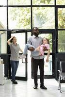 Young couple face pediatric medical crisis after daughter faints in lobby, asking for urgent support from black medical team in response to sudden collapse and serious health scare. photo