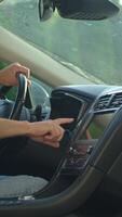 Man sitting in car and pressing engine start button. Starting vehicle using modern ignition technology. Person ready to driving car video