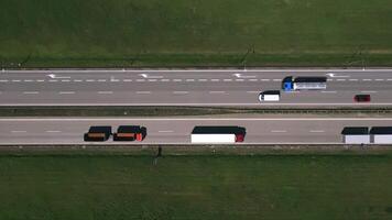 Highway traffic with cars and trucks in motion, top view video