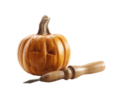 Carved pumpkin with sculpting tool for Halloween decoration png