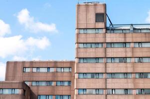 Urban architecture of a modern high-rise building against a clear sky photo
