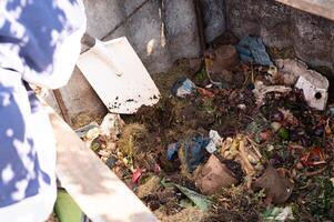 Learn About Composting Day Composting process organic waste decomposition with shovel in bin photo