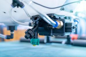 Close-up of a solenoid valve and chemical sprayer nozzle. High-tech agricultural drone, used for precision pesticide and fertilizer spraying in modern smart farming. Automated agriculture systems. photo