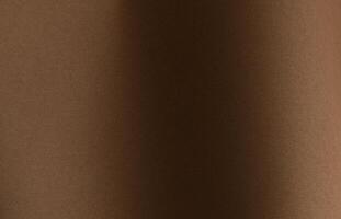 Chocolate brown designer paper sheet with smooth matte texture. Simple, minimalistic backdrop, photo