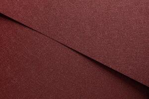 Chic paper background in red and marsala. Metallic sheets with glossy gradient, smooth surface, photo