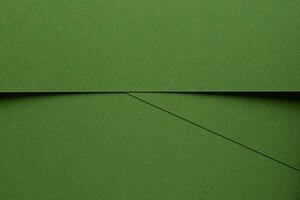 Chic green texture background. Monochrome matte surface with smooth fiber detail, geometric overlay photo
