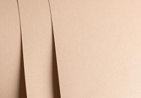 Elegant designer paper background. Beige and cream sheets with geometric overlap, punched edges, photo