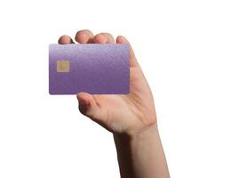 holding a violet and purple gradient bank card for payment at an ATM, symbolizing secure financial photo