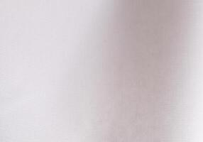 Refined white paper texture with a woven pattern, creating a subtle, minimalistic backdrop. The photo