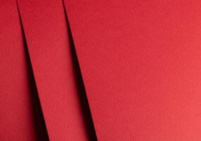 Premium red designer paper sheet with smooth matte texture. Bright, festive background with photo
